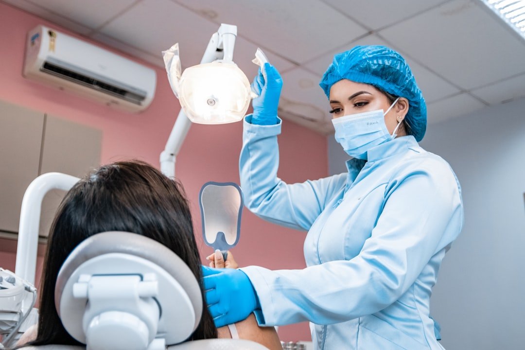 Dental professional examining a patient, used as a general dental care illustration